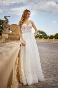 Herm’s Bridal IKSAN wedding dress – A-line, romantic, embellished, flowy, lace and tulle, plunging neckline, corset bodice, sweetheart neckline, bare shoulders, no train