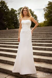 Herm’s Bridal INDEE wedding dress – simple, modest, mermaid, slim, lace and crepe, corset bodice, straight neckline, bare shoulders, no train, with train